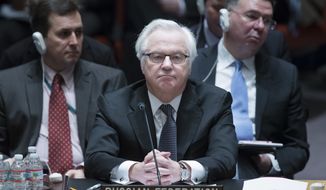 Russia&#x27;s U.N. Ambassador Vitaly Churkin listens during a U.N. Security Council meeting on the Ukraine crisis, Saturday, March 15, 2014, at United Nations headquarters. (AP Photo/John Minchillo)