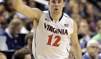 Virginia&#39;s Joe Harris celebrates after making a 3-point basket against Duke during the second half of an NCAA college basketball game in the championship of the Atlantic Coast Conference tournament in Greensboro, N.C., Sunday, March 16, 2014. (AP Photo/Gerry Broome)