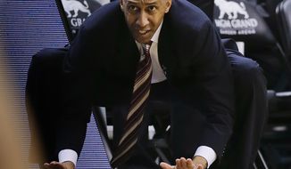 Stanford coach Johnny Dawkins encourages his team in the second half of an NCAA Pac-12 conference tournament college basketball game against Washington State, Wednesday, March 12, 2014, in Las Vegas. Stanford won 74-63.  (AP Photo/Julie Jacobson)