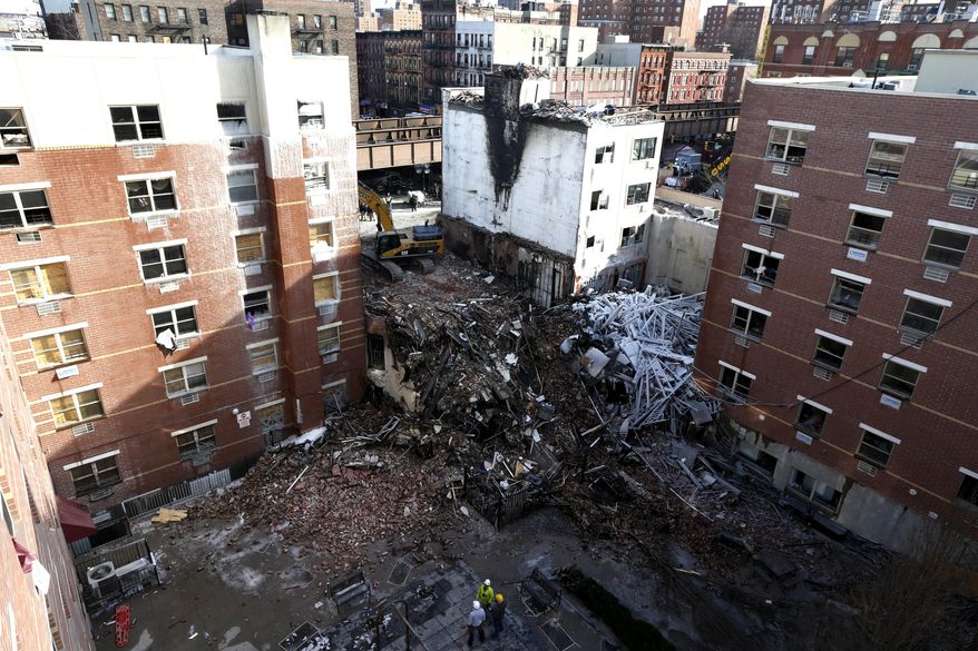Rubble is seen Friday, March 14, 2014, two days after a natural gas explosion leveled two apartment buildings in New York, Friday, March 14, 2014. Using sound devices to probe for voices and telescopic cameras to peer into small spaces, workers searching a pile of rubble from a gas explosion in the East Harlem section of Manhattan, continued to treat it as a rescue operation, holding onto the possibility of finding survivors from a blast that brought down two apartment buildings and killed at least eight people. (AP Photo/Julio Cortez)