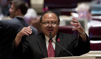 ** FILE ** In this Tuesday, March 20, 2012, file photo, Rep. Alvin Holmes, D-Montgomery, questions a bill that would require candidates for sheriff to have law enforcement training during their session at the Alabama Statehouse in Montgomery, Ala. (AP Photo/Dave Martin, File)