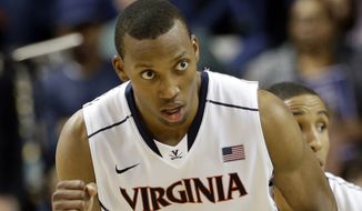 Virginia&#39;s Akil Mitchell reacts after making a basket against Duke during the second half of an NCAA college basketball game in the championship of the Atlantic Coast Conference tournament in Greensboro, N.C., Sunday, March 16, 2014. (AP Photo/Gerry Broome)