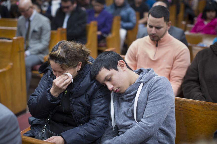 Parishioners mourn during Sunday services at the Church of God of Third Avenue as the congregation welcomed members of the Spanish Christian Church that was destroyed by Wednesday&#39;s explosion in the East Harlem neighborhood of New York, Sunday, March 16, 2014. The Spanish Christian Church had been located on the first floor of one of the destroyed buildings. On Saturday a crew at the blast site found a large Bible in the rubble and returned it to the church&#39;s pastor. (AP Photo/John Minchillo)