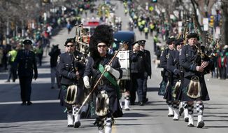 The Boston Police Gaelic Column marches in the annual St. Patrick&#39;s Day parade in the South Boston neighborhood of Boston, Sunday, March 16, 2014. (AP Photo/Michael Dwyer) ** FILE **