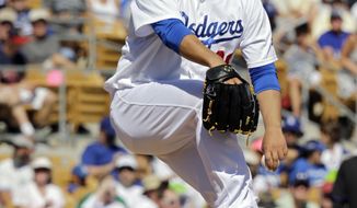Los Angeles Dodgers starting pitcher Hyun-Jin Ryu delivers against the Colorado Rockies in the fifth inning of a spring exhibition baseball game on Sunday, March 16, 2014, in Glendale, Ariz. (AP Photo/Mark Duncan)