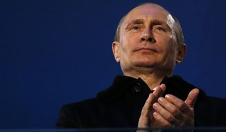 Russian President Vladimir Putin attends the closing ceremony of the 2014 Winter Paralympics at the Fisht Olympic stadium in Sochi, Russia, Sunday, March 16, 2014.  (AP Photo/Dmitry Lovetsky)
