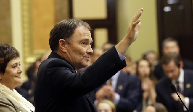 Utah Gov. Gary Herbert addresses the Utah House of Representatives after the House of Representatives finished business Thursday, March 13, 2014, at the Utah State Capitol, in Salt Lake City. After 45-days of meetings and debate, hundreds of bills and a few protests, the 2014 legislative session closed after midnight Thursday.  (AP Photo/Rick Bowmer)