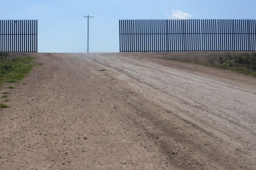 This photo made, Saturday, March 15, 2014 shows the Abram border fence in Abram, Texas., near where a migrant women, an adult who was traveling with her teenage daughter and a teenage friend, was spotted by a Border Patrol camera Wednesday afternoon. Officials said her wrists had been cut and were bloodied. She was one of three female immigrants from Honduras who, according to officials, tried to surrender to Border Patrol Agent Esteban Manzanares Wednesday afternoon near Anzalduas Park on Mission, Texas. Manzanares killed himself early Thursday and the FBI is investigating allegations that he kidnapped and assaulted the migrants before committing suicide. (AP Photo/Alicia A. Caldwell)