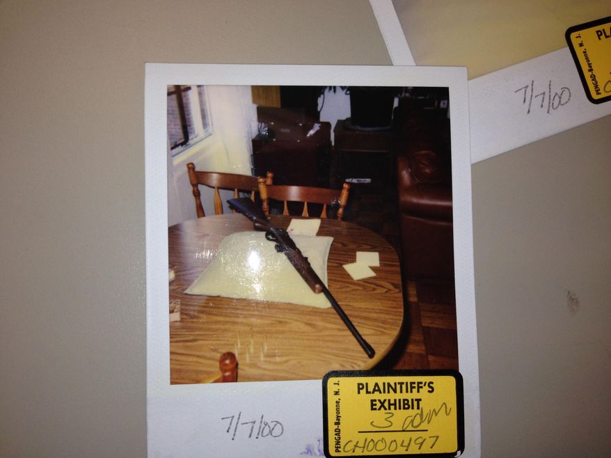 This handout image provided by the Alexandria, Va. Circuit Court shows a Polaroid photo of a rifle, laid on a pillow, and was taken in 2000 as part of a custody dispute in Alexandria Circuit Court involving longtime city resident Charles Severance. The mother of Severance's child sought a protective order after saying she found the weapon laid out meticulously when she returned to the home they shared. Severance is now a suspect in three unsolved slayings of Alexandria residents going back the last 10 years, according to prosecutor Scott Smith in Ohio County, W.Va., where Severance is currently being held.. (AP Photo/Alexandria, Va. Circuit Court)