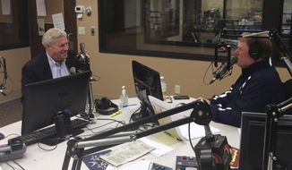 U.S. Rep. Collin Peterson, D-Minn., left, chats with KFGO-AM radio host Joel Heitkamp on Monday, March 17, 2014, on Heitkamp’s public affairs show in Fargo, N.D. Peterson announced during the show that he plans to seek a 13th term in his northwest Minnesota seat. (AP Photo/KFGO-AM, Amy Iler)