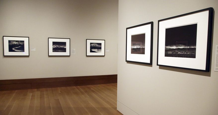 This March 14, 2014 photo shows a photo exhibit entitled, "In Focus: Ansel Adams" at the J. Paul Getty Museum in Los Angeles. Toward the end of his life, photographer Ansel Adams pored over thousands of negatives he'd carefully kept since his teens and set aside 70 that he considered his best works of art. He offered to sell sets of 25, with strings attached: Adams would select 10 and let buyers choose the other 15; the images printed by Adams himself could never be resold, only left to a museum. The few dozen who made the cut included the late Leonard and Marjorie Vernon, whose collection was given to the J. Paul Getty Museum and is the centerpiece of "In Focus: Ansel Adams." (AP Photo/Nick Ut)