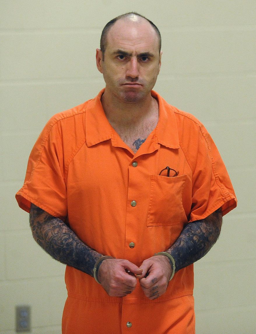 This July 25, 2013 photo shows James McVay being escorted to court in Sioux Falls, S.D. McVay pleaded guilty but mentally ill to first-degree murder in the stabbing death of Maybelle Schein, 75, on July 2, 2011. Jury selection began Monday, March 17, 2014, in the sentencing hearing for McVay, who killed Schein as part of a cross-country plot to assassinate the president in July 2011. (AP Photo/Argus Leader, Jay Pickthorn) NO SALES