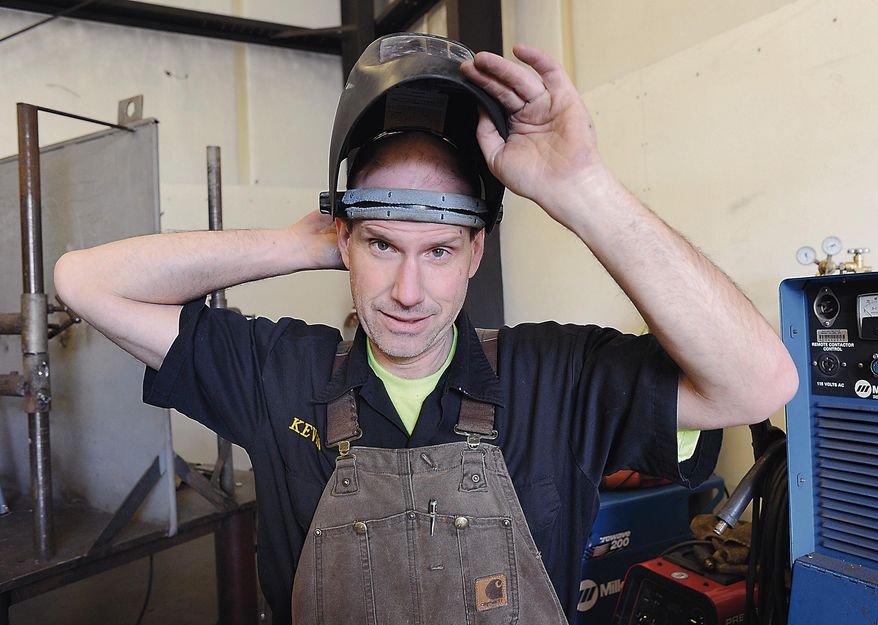 Skagit Valley College welding student Kevin Riley gets ready to practice some welds in preparation for his end of quarter test on March 13, 2014 in Mount Vernon, Wash. The welding shop in Skagit Valley College's Reeves Hall is a far cry from the prison cell Kevin Riley spent about five years in until his January 2012 release. "It was more of a personal goal," Riley said of going back to school. "I think I had a chip on my shoulder and just wanted to prove that, at 43, I could do this. I wanted to be a good example for my daughter." (AP Photo/The Skagit Valley Herald, Scott Terrell)