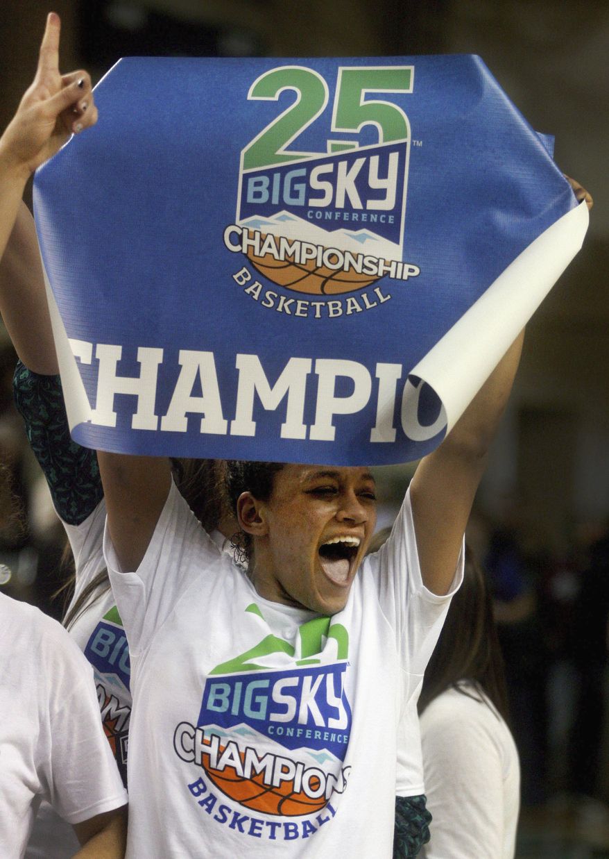 FILE - In this March 15, 2014 file photo, North Dakota's Mia Loyd celebrates the team's 72-55 championship win over Montana in the Big Sky Conference women's NCAA college basketball game in Grand Forks, N.D. On Monday night, March 17, 2014, UND will find out who they will play in the first round of the NCAA Tournament. (AP Photo/Bruce Crummy, File)