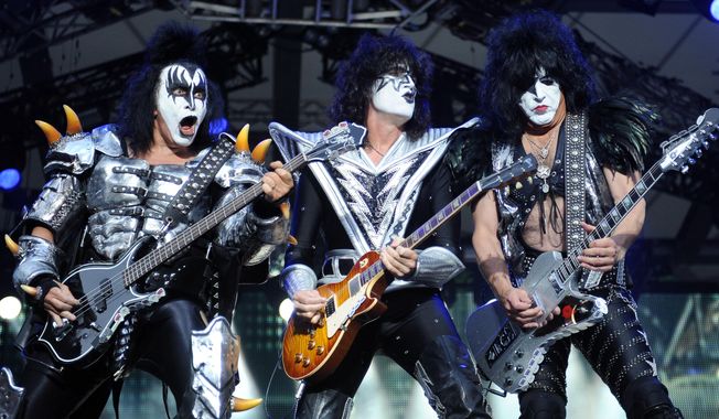 From left, bassist Gene Simmons , guitarist Tommy Thayer and singer Paul Stanley of the U.S. band Kiss perform on stage in Berlin, Germany, June 13, 2013. (AP Photo/dpa,Britta Pedersen)