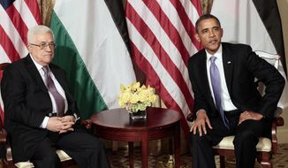 In this Sept. 21, 2011, photo, President Barack Obama and Palestinian President Mahmoud Abbas are seen during a meeting in New York. (AP Photo/Pablo Martinez Monsivais, File)