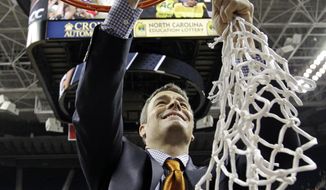 Virginia head coach Tony Bennett cuts down the net after defeating Duke in an NCAA college basketball game in the championship of the Atlantic Coast Conference tournament in Greensboro, N.C., Sunday, March 16, 2014. Virginia won 72-63. (AP Photo/Bob Leverone)