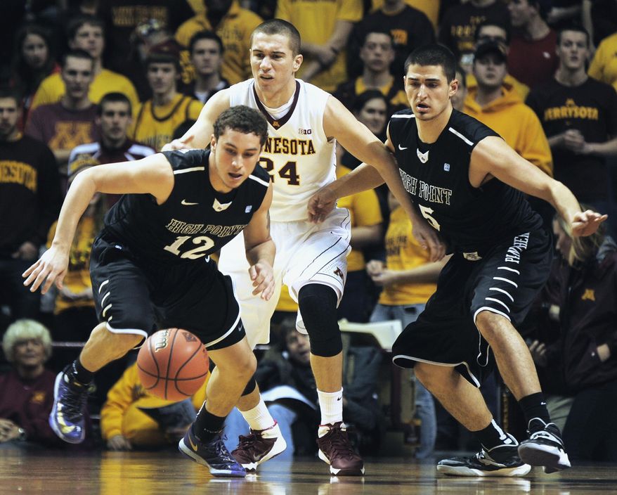 High Point's Jorge Perez-Laham, left and Lorenzo Cugini, right go after a loose ball with Minnesota's Joey King, center, during the first half of an NCAA college basketball game in the first round of the National Invitational Tournament in Minneapolis, Tuesday, March 18, 2014. (AP Photo/Tom Olmscheid)