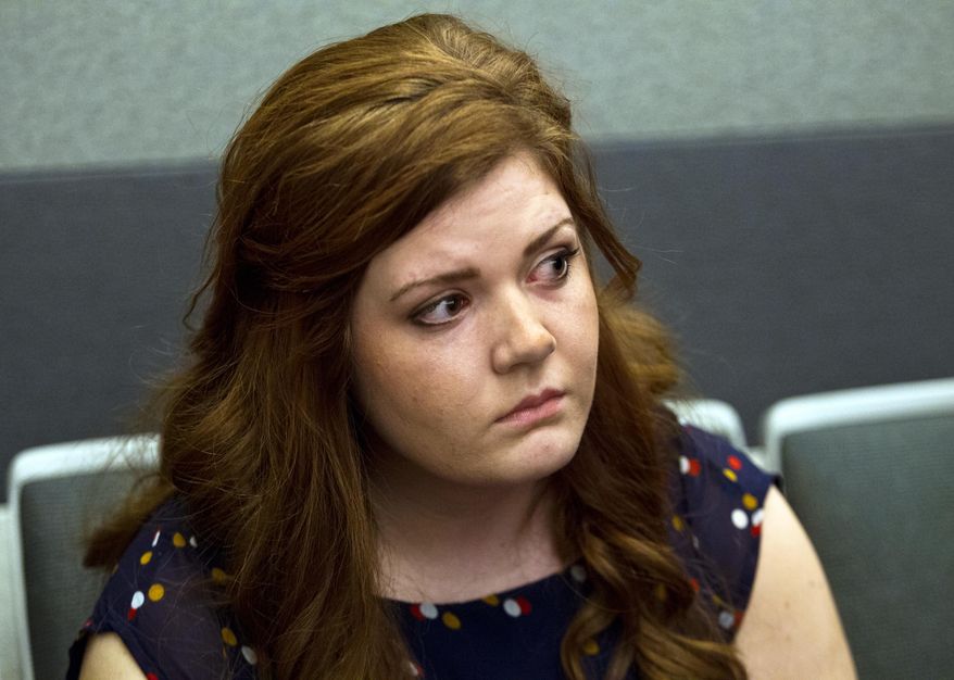 Former Foothill High School teacher Amanda Brennan, who pleaded guilty to romancing a teenager, listens during her sentencing hearing in Las Vegas Tuesday, March 18, 2014. Brennan was sentenced Tuesday to five years of probation for an inappropriate relationship with a teenage student almost a year ago. (AP Photo/ Las Vegas Sun, L.E. Baskow)