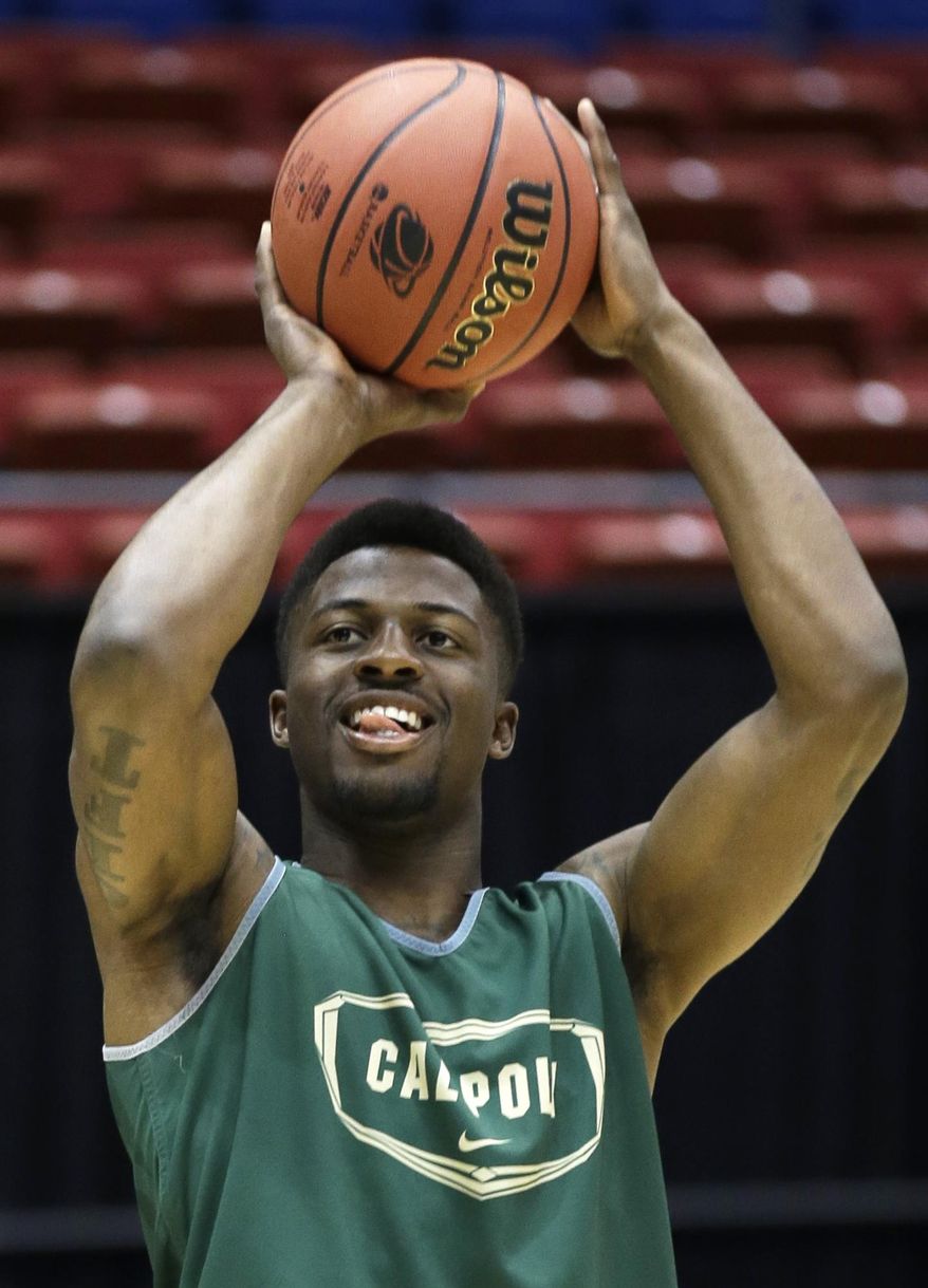 Cal Poly guard Dave Nwaba shoots during practice for an NCAA college basketball tournament game, Tuesday, March 18, 2014, in Dayton, Ohio. Cal Poly plays Texas Southern Wednesday evening in a first round game. (AP Photo/Al Behrman)