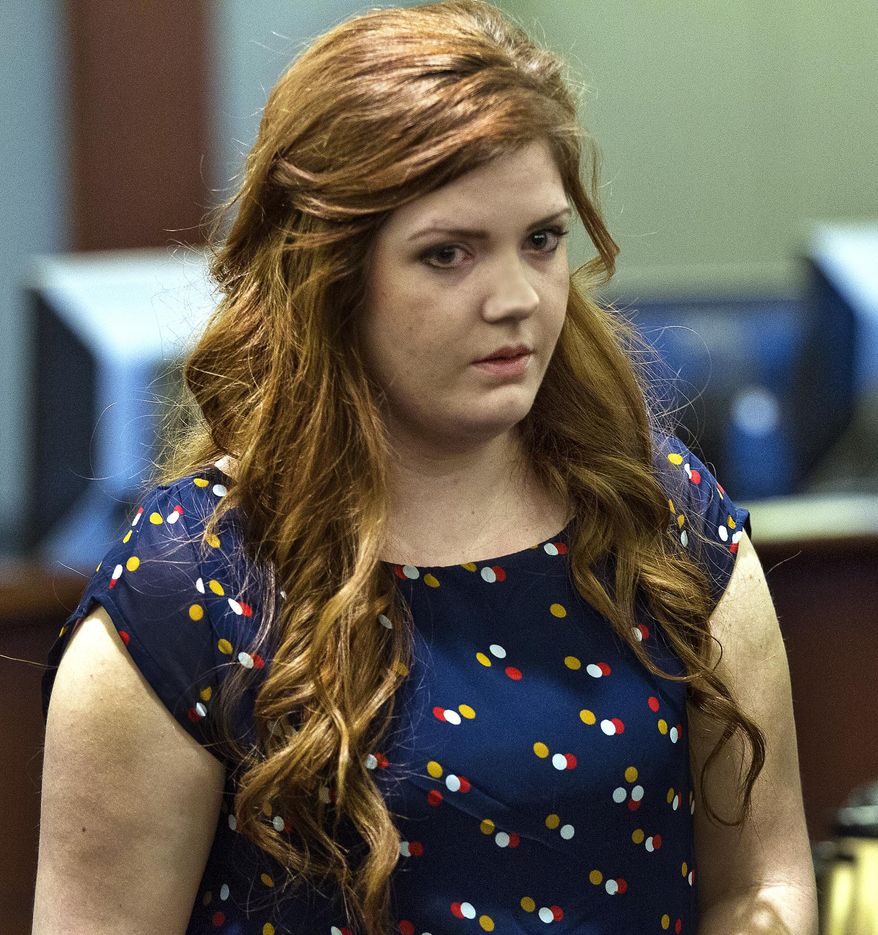 Former Foothill High School teacher Amanda Brennan, who pleaded guilty to romancing a teenager, listens as she is sentenced by Las Vegas District Court Judge James A. Brennan in Las Vegas Tuesday, March 18, 2014. Brennan was sentenced Tuesday to five years of probation for an inappropriate relationship with a teenage student almost a year ago. (AP Photo/ Las Vegas Sun, L.E. Baskow)