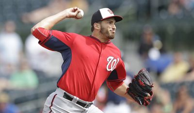 Washington Nationals relief pitcher Christian Garcia throws during the sixth inning of a spring exhibition baseball game against the Houston Astros in Kissimmee, Fla., Sunday, March 16, 2014. (AP Photo/Carlos Osorio)