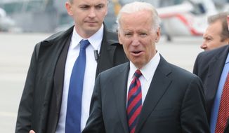 U.S. Vice President Joe Biden gestures as he arrives at the Okecie military airport in Warsaw, Poland, Tuesday, March 18, 2014. Biden arrived in Warsaw for consultations with Polish Prime Minister Donald Tusk and President Bronislaw Komorowski, a few hours after Russian President Vladimir Putin approved a draft bill for the annexation of Crimea, one of a flurry of steps to formally take over the Black Sea peninsula. (AP Photo/Alik Keplicz)