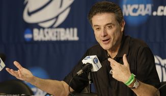 Louisville head coach Rick Pittino answers questions at a news conference for the NCAA college basketball tournament in Orlando, Fla., Wednesday, March 19, 2014.  Manhattan plays against Louisville in a second round game on Thursday. (AP Photo/John Raoux)