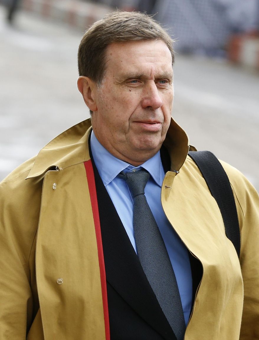 FILE - This is a Monday, Oct. 28, 2013 file photo of former News of The World national newspaper royal editor Clive Goodman as arrives at The Old Bailey law court in London. Goodman who was jailed for phone hacking has told a British court Wednesday March 19, 2014, that the tabloid’s editor, Andy Coulson, authorized payments for the illegal eavesdropping.(AP Photo/Kirsty Wigglesworth, File)