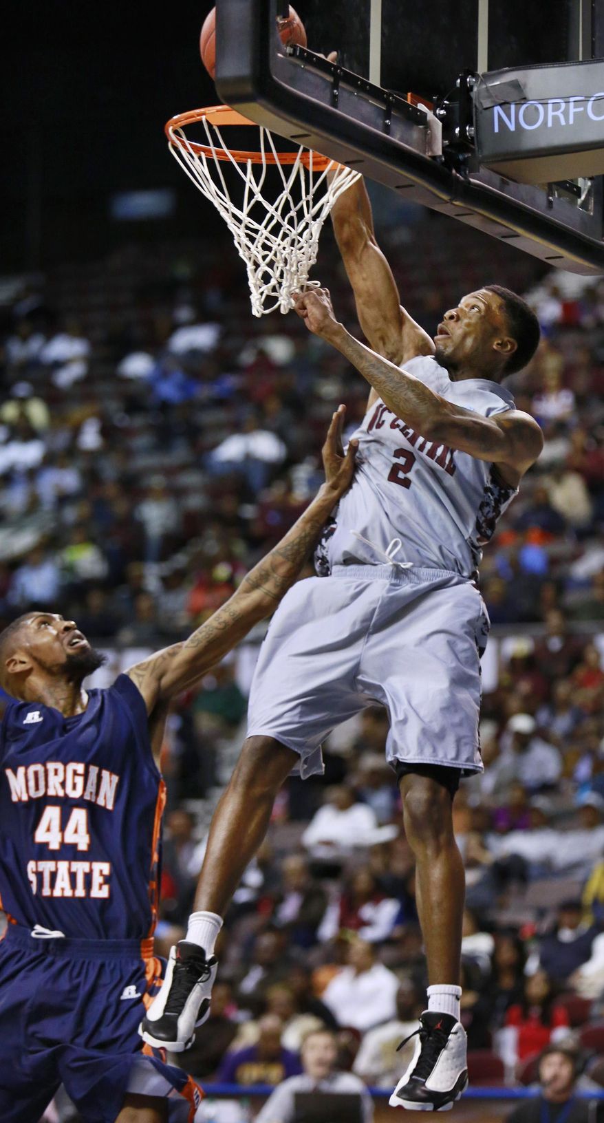 North Carolina Central’s Jordan Parks (2) tries to tip the ball in as Morgan State’s Shaquille Duncan (44) defends during the first half of the MEAC championship game, Saturday, March 15, 2014, in Norfolk, Va. Central defeated Morgan State 71-62. (AP Photo/The Virginian-Pilot, Stephen M. Katz)