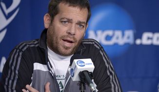 Manhattan coach Steve Masiello speaks during a news conference for the NCAA men&#39;s college basketball tournament, Wednesday, March 19, 2014, in Orlando, Fla. Manhattan will play Louisville in a second-round game Thursday. (AP Photo/Phelan Ebenhack)