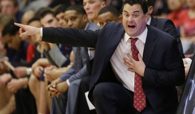 FILE - In this Jan. 29, 2014, file photo, Arizona coach Sean Miller gestures to his players during an NCAA college basketball game against Stanford  in Stanford, Calif. John Miller’s sons _ Sean, who coaches No. 1 West seed Arizona; and younger brother Archie, who coaches No. 11 South seed Dayton _ could meet in the Final Four. (AP Photo/Marcio Jose Sanchez, File)