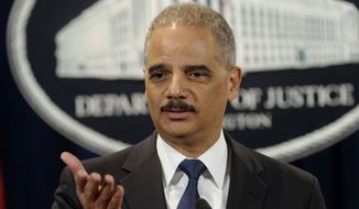 Attorney General Eric Holder announces a $1.2 billion settlement with Toyota over its disclosure of safety problems, Wednesday, March 19, 2014, during a news conference at the Justice Department in Washington. (AP Photo/Susan Walsh)