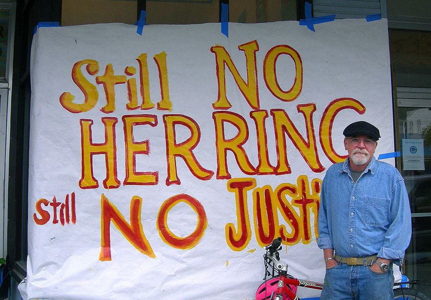 This undated file photo provided by Robert J. Kopchak, shows Robert J. Kopchak standing by a sign in front of the Fisherman's Union Hall in Cordova, Alaska. Kopchak lost a quarter of his earnings when the lucrative Pacific herring fishery crashed in the 1990s after the Exxon Valdez oil spill in Alaska's Prince William Sound. Nearly 25 years after the Exxon Valdez oil spill off the coast of Alaska, some damage heals, some effects linger in Prince William Sound. (AP Photo/Obadiah Kopchak, File) ** NO SALES **