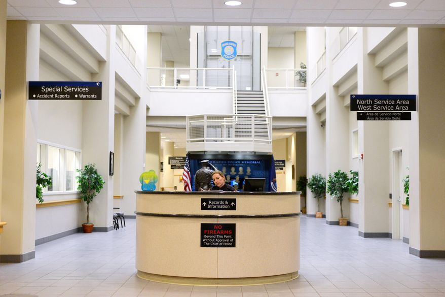 The Grand Rapids police station lobby will be receiving a $345,000 renovation this summer. Renovations will include walling off the area near the officer memorial and installing bullet-proof glass, and the removal off the officer kiosk. (Emily Rose Bennett | MLive.com)