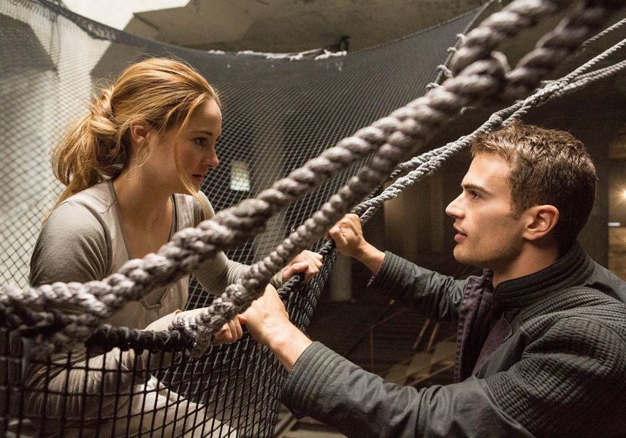 Shailene Woodley, left, stars as Beatrice, with Theo James as her trainer, Four, in "Divergent." (Summit Entertainment/Associated Press)