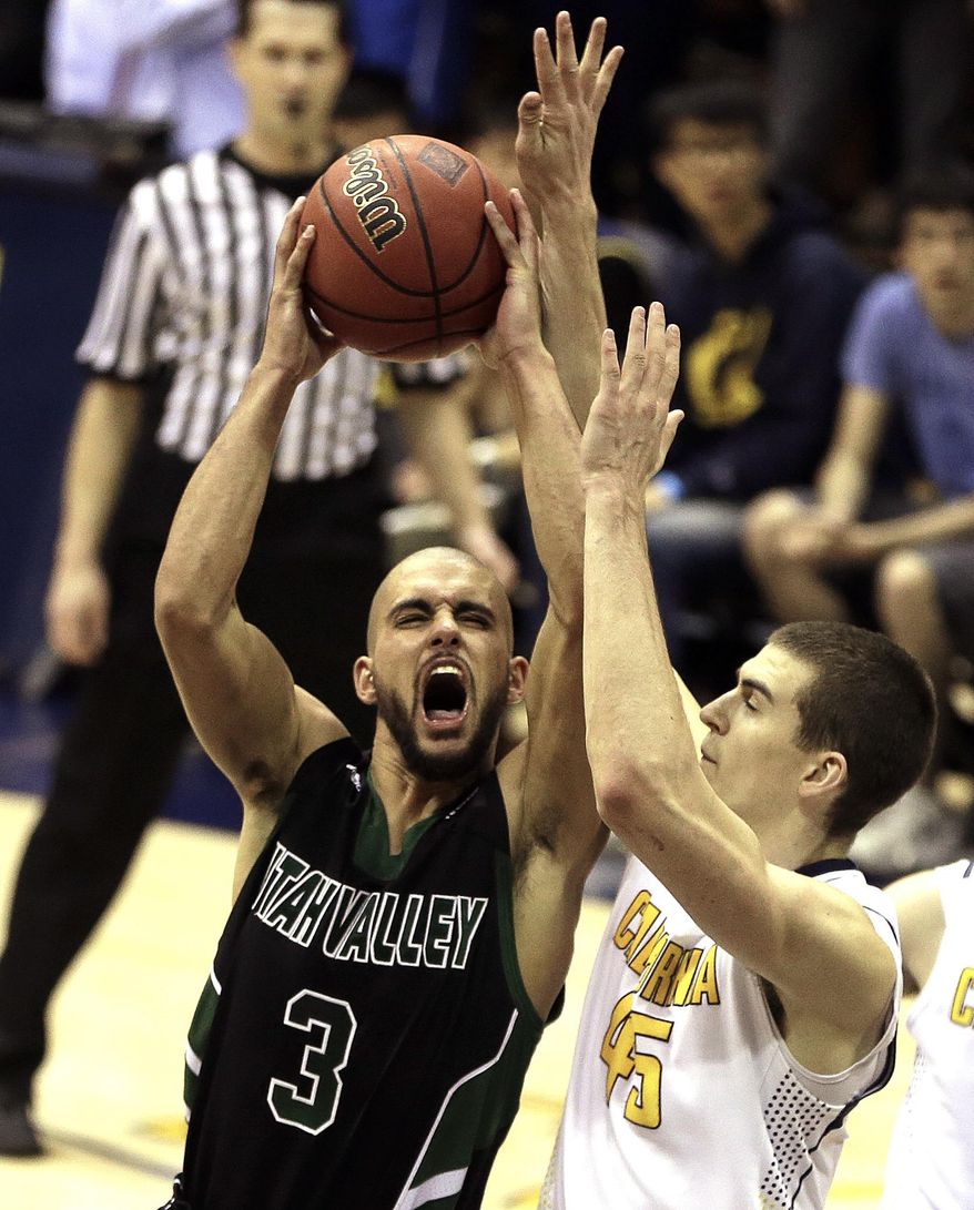 Utah Valley's Keawe Enos (3) drives the ball against California's David Kravish, right, in the second half of an NCAA college basketball game in the NIT tournament, Wednesday, March 19, 2014, in Berkeley, Calif. (AP