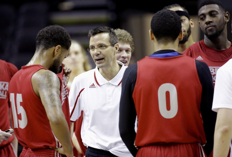 Nebraska coach Tim Miles, center, talks to his team during practice for the NCAA college basketball tournament in San Antonio, Thursday, March 20, 2014. Nebraska plays against Baylor in a second-round game on Friday. (AP Photo/David J. Phillip)