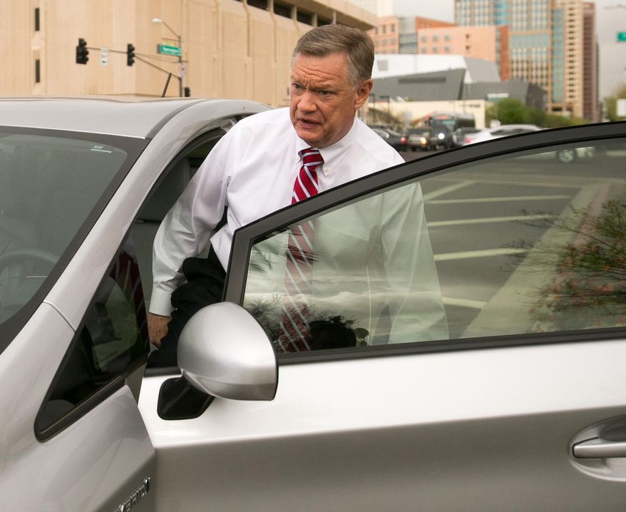 FILE - Former Fiesta Bowl executive director John Junker gets into his car outside the Sandra Day O'Connor U.S. courthouse after being sentenced in Phoenix on in this March 13, 2014 file photo. The sentencing Thursday March 20, 2014 of 58-year-old John Junker in Maricopa County Superior Court will mark the end of criminal cases that arose from the contribution scandal that jeopardized the bowl's NCAA license and led to the ouster of the longtime bowl leader. (AP Photo/The Arizona Republic, Michael Schennum, File) MARICOPA COUNTY OUT; MAGS OUT; NO SALES