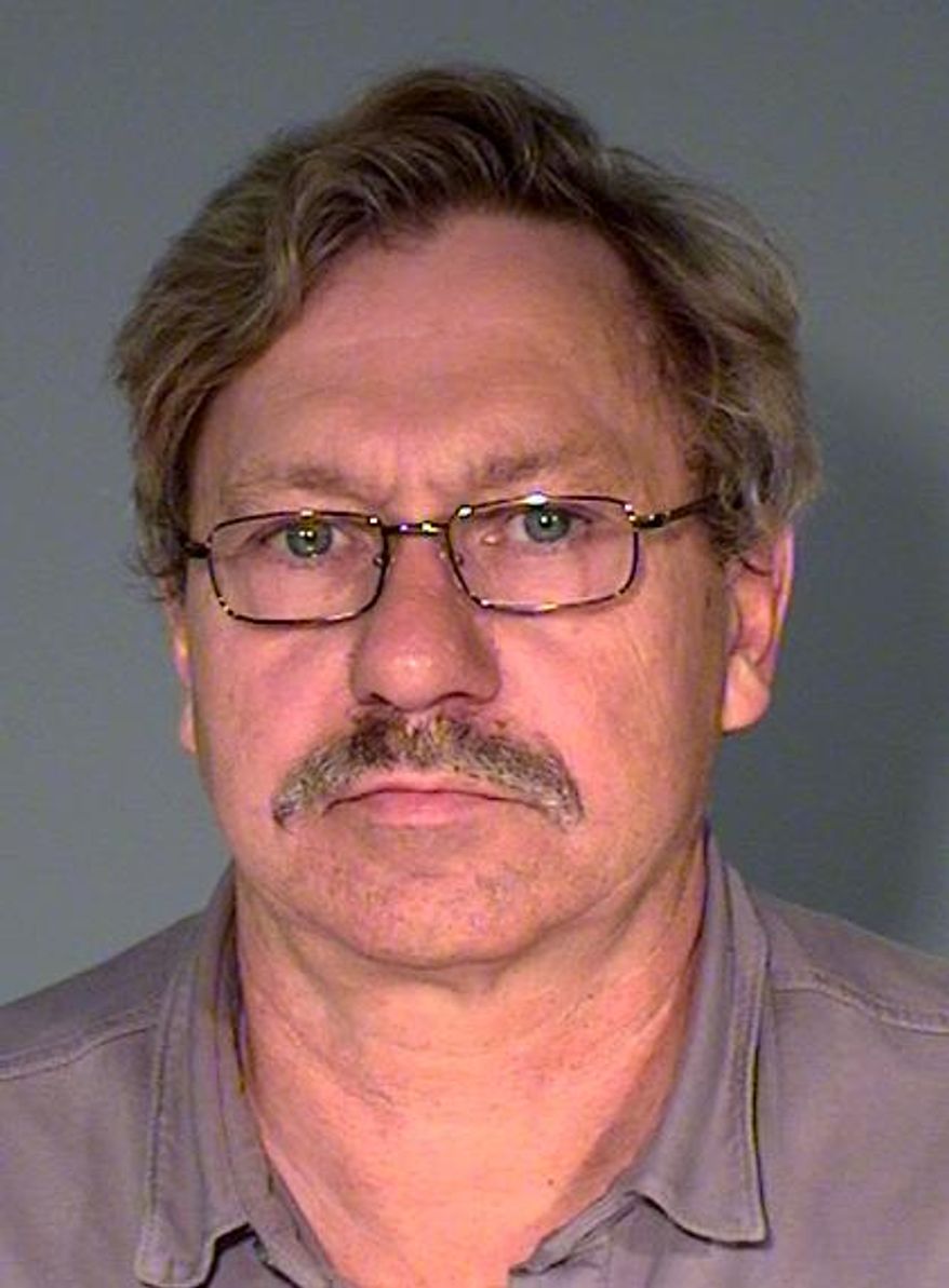 This photo provided by the Ramsey County Jail shows Walter J. Happel, 62, who is charged with peeking underneath a bathroom stall at a student in St. Paul, Minn. The Star Tribune reports the bathroom incident is the latest in a number of alleged transgressions with young boys that go back as far as 2003. (AP Photo/Ramsey County Jail)