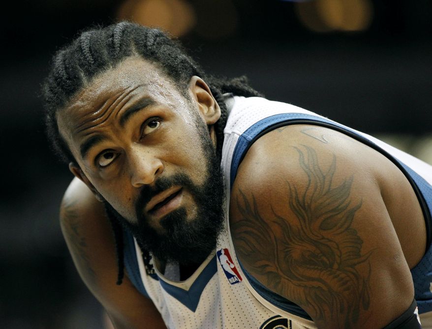 ADVANCE FOR WEEKEND EDITIONS, MARCH 22-23 - FILE - In this Feb. 19, 2014, file photo, Minnesota Timberwolves center Ronny Turiaf checks the clock against the Indiana Pacers during their NBA basketball game in Minneapolis. Turiaf, Phoenix's Channing Frye, Boston's Jeff Green and Toronto's Chuck Hayes, all have recovered from serious heart conditions to continue their careers. (AP Photo/Andy Clayton-King, File)