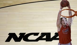 New Mexico&#39;s Cameron Bairstow dunks the ball during practice for the NCAA college basketball tournament Thursday, March 20, 2014, in St. Louis. New Mexico is scheduled to play against Stanford in a second-round game on Friday. (AP Photo/Charlie Riedel)
