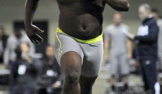 Notre Dame defensive lineman Louis Nix runs through a drill during Notre Dame&#39;s Pro Day for NFL football scouts Thursday, March 20, 2014, in South Bend, Ind.  (AP Photo/Joe Raymond)