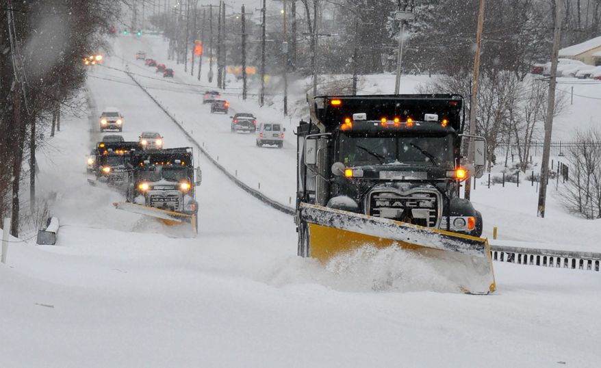 FILE - In this Feb. 13, 2014 file photo a line of trucks with plows head south on Route 202 between Dilworthtown Road and Route 1 in Birmingham Township, Pa. As spring officially begins Thursday, officials across much of the nation are still paying the bills for keeping roads clear during the cold, snowy winter. In Pennsylvania, legislators have approved special appropriations that will help but won’t pay for everything. (AP Photo/Philadelphia Inquirer, Clem Murray, File)