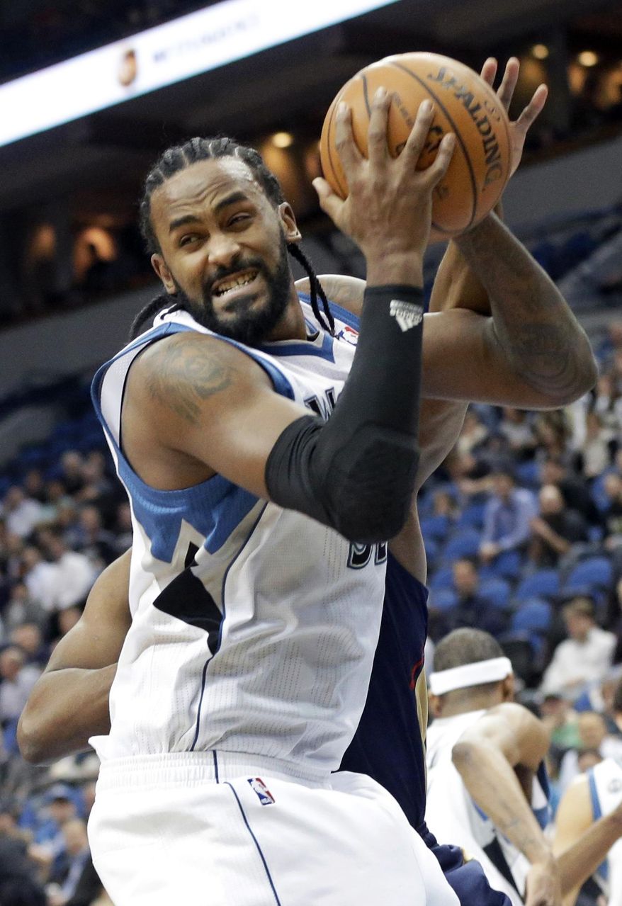 ADVANCE FOR WEEKEND EDITIONS, MARCH 22-23 - FILE - In this Jan. 29, 2014, file photo, Minnesota Timberwolves' Ronny Turiaf pulls down a rebound in the first quarter of an NBA basketball game against the New Orleans Pelicans in Minneapolis. Turiaf, Phoenix's Channing Frye, Boston's Jeff Green and Toronto's Chuck Hayes, all have recovered from serious heart conditions to continue their careers. (AP Photo/Jim Mone, File)