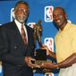 Chicago Bulls&#39; Michael Jordan, right, holds his fifth Most Valuable Player award with Bill Russell of the Boston Celtics at a ceremony in Northbrook, Ill., Monday, May 18, 1998. Jordan perviously won the award in 1998, 1991, 1992, and 1996. Russell, who presented the award, is the only other five-time winner.  (AP Photo/Jay Crihfield)