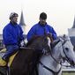 FILE - In this April 28, 2004, file photo, trainer Steve Asmussen, right, leads Kentucky Derby hopeful Quintons Gold Rush and exercise rider Scott Blasi off the track after a morning workout at Churchill Downs in Louisville, Ky. Thoroughbred racing regulators in New York and Kentucky are investigating allegations of mistreatment of horses by the Hall of Fame-nominated trainer and his top assistant. The states&#39; racing commissions said Thursday, March 20, 2014, investigations were launched after People for the Ethical Treatment of Animals provided video evidence from an undercover investigation of Asmussen and associates.  (AP Photo/Daniel P. Derella, File)