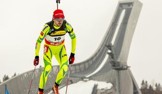Winner Jakov Fak from Slovenia competes in the men&#x27;s IBU Biathlon World Cup sprint 10 km in the Holmenkollen Ski Arena in Oslo, Thursday, March 20, 2014. (AP Photo/Erlend Aas/NTB scanpix)   NORWAY OUT