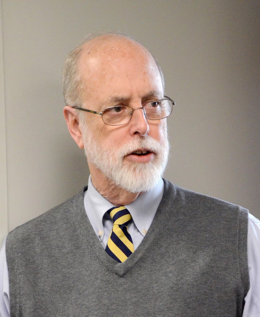 ADVANCE FOR MONDAY, MARCH 24- In an Oct. 17, 2013 photo, Calhoun County District Judge John Holmes is photographed in Battle Creek, Mich. Holmes has announced he will retire June 7 after 21 years on the bench and 44 years as an attorney. (AP Photo/Battle Creek Enquirer, Trace Christenson)