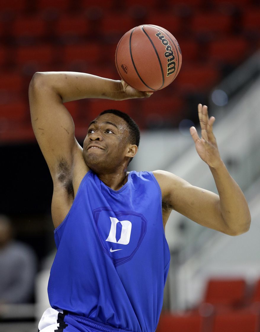 Duke's Jabari Parker goes up to dunk during practice at the NCAA college basketball tournament in Raleigh, N.C., Thursday, March 20, 2014. Duke plays Mercer in a second-round game on Friday. (AP Photo/Gerry Broome)